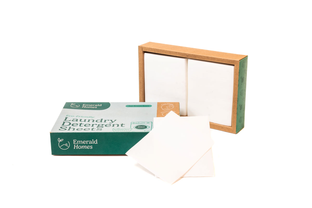 Emerald Homes laundry detergent sheets box with loose white sheets and an open inner tray